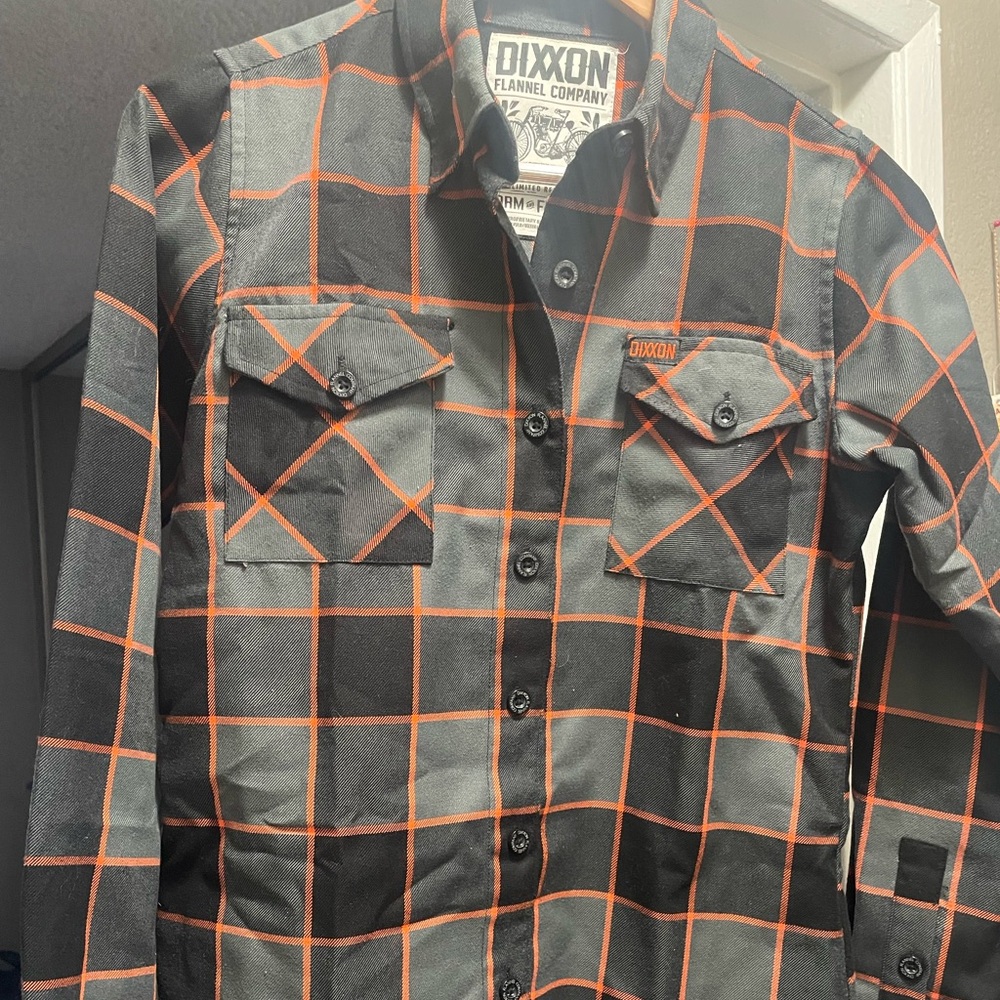 A women's small flannel shirt in excellent condition for sale.